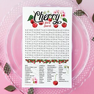 May include: A printable cherry-themed word search puzzle with a floral border. The puzzle features words related to cherries, such as "bing", "cherry on top", "cola", "compote", "sundae", "tart", and "turnover".