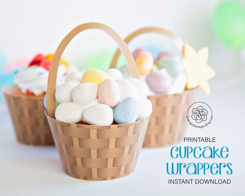 May include: Printable cupcake wrappers in the shape of brown baskets with handles. The baskets are filled with pastel colored candy eggs. The text "PRINTABLE CUPCAKE WRAPPERS INSTANT DOWNLOAD" is at the bottom of the image.