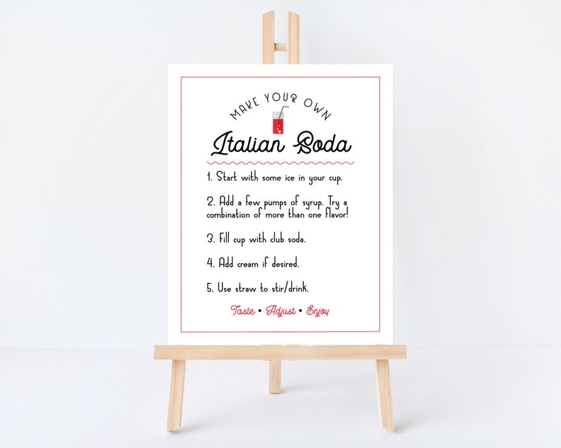 May include: A white sign with red text and a red illustration of a glass of Italian soda. The sign instructs how to make your own Italian soda with ice, syrup, club soda, and cream. The text reads "Make Your Own Italian Soda".