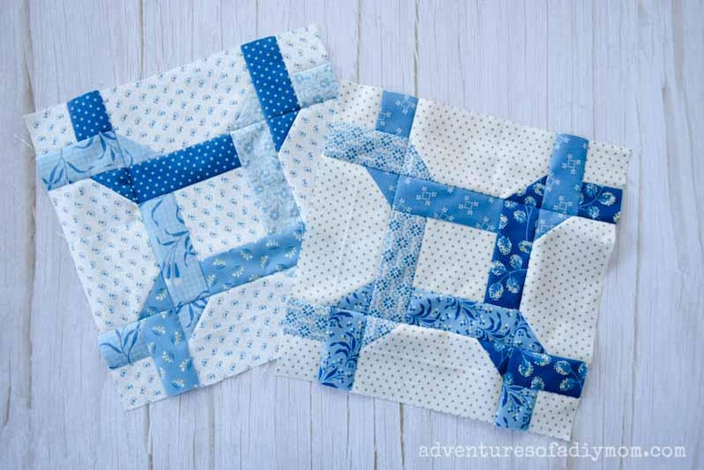 May include: Two blue and white patchwork quilt blocks with a geometric design. The blocks are made with different blue fabrics with white polka dots, floral patterns, and solid blue.