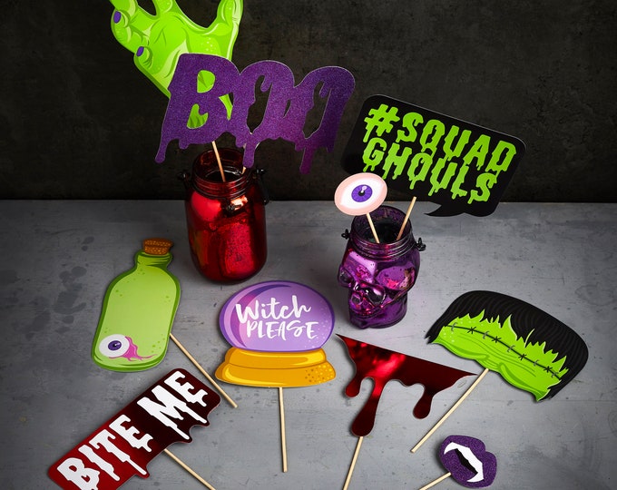 FABULOUSLY CREEPY HALLOWEEN photo booth props for a spoktackular halloween bash eyeballs and vampire teeth mummies and zombies are all here