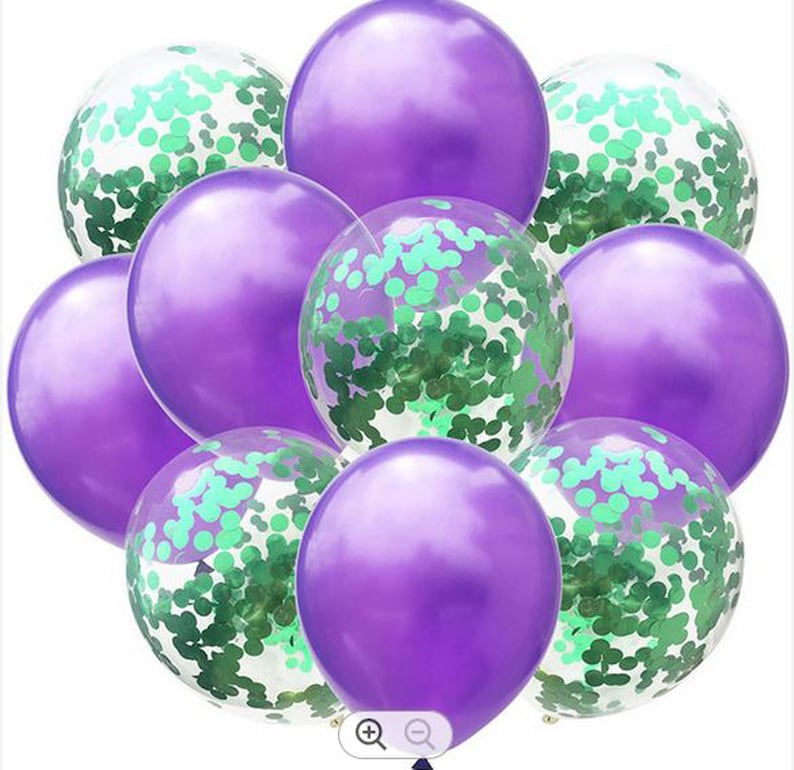 May include: A group of purple and clear balloons with green confetti inside. The balloons are arranged in a cluster, with some overlapping.