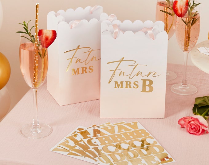 Chic gold and white & pink bridal shower party gift bags. and gold foiling stickers to personalise and pink ribbon handles