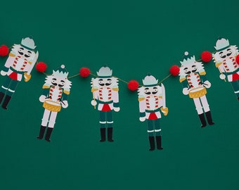CHRISTMAS NUTCRACKER soldier POMPOM garland bunting in traditional christmas colours red white green and gold 2 meters