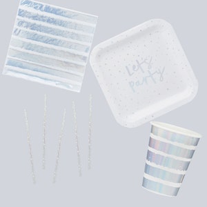 May include: A set of iridescent white party supplies including plates, cups, napkins, and straws. The plates have a white polka dot pattern and the text "Let's Party".
