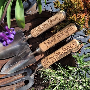 set of three garden tools with wooden handles and steel tops, a fork, a trowel a planter, hand engraved in a calligraphy font with the words If Dads were flowers...I would pick you! All my love, Louise ❤ or you can choose your own messages