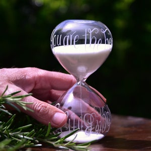 glass sand timer hand engraved with any message of your choice in a calligraphy font