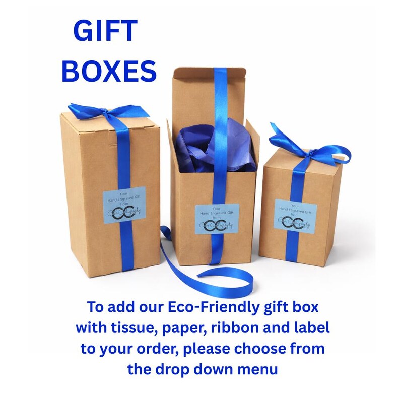 May include: Three brown cardboard gift boxes of varying heights, each wrapped with a bright blue satin ribbon. The center box is open, revealing blue tissue paper inside. Each box features a light blue rectangular label with the text CC Calligraphy.