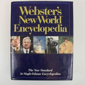 May include: A blue hardcover book with the title "Webster's New World Encyclopedia" in gold lettering. The cover features a collage of images including a rocket, a man in a suit, and a woman with a child.