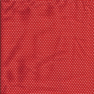 May include: Red fabric with a repeating pattern of small white polka dots. The fabric has a slightly textured appearance and is evenly lit, showing the consistent dot pattern across the surface.