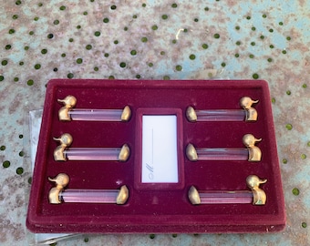 6 portes couteaux en verre et metal dore a l'or fin 24 carats, marques places, dans leur boite d origine made in france