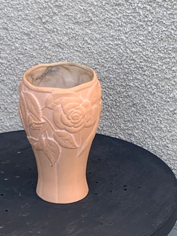 Ceramic terracotta vase with a vintage relief rose pattern