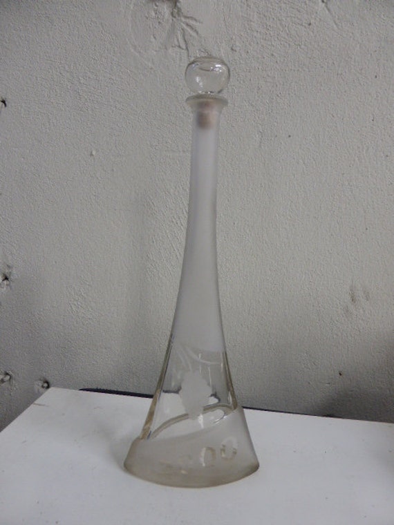 Liquor bottle with a form of Eiffel tower, design, 2000. frosted glass and transparent glass with a bunch of grapes in frosted glass