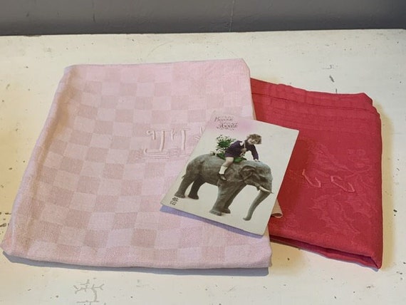Duo lot, composed of two large pink-dyed cotton and linen towels, embroidered, TK and CC monograms, and old postcard, Art Deco