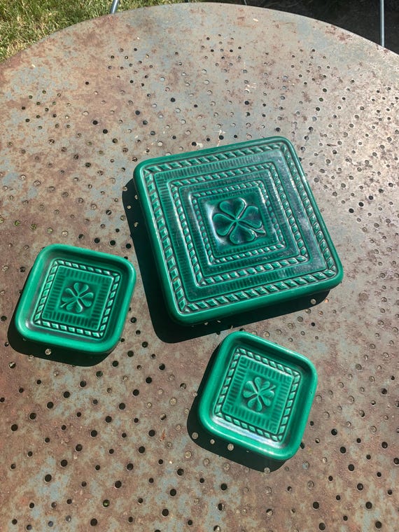 Green glazed ceramic trivet and two bottle coasters, barbotine cast, clover pattern, vintage 1950’s