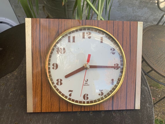 JAZ TRANSISTOR pendulum, Formica imitation wood and metal, bomb glass in front, vintage 1960/70