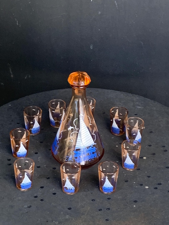 Liqueur set, pink glass decanter and 10 small glasses with sailboat and seagull motifs, seaside, vintage 1950s
