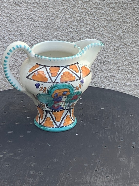 Pitcher in enameled ceramic, Italian ceramic SCO ORVIETO, made in italy, character of man and woman painted by hand