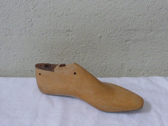 Shape for shoe in wood and metal, old, object of trade, shoemaker, vintage