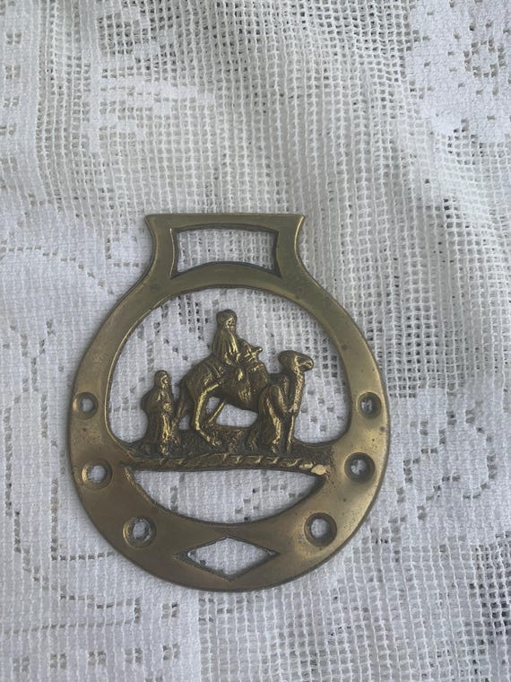 Bottle opener in brass, copper, gold metal, with bedouin, camel motif, vintage