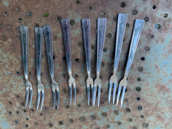 8 small stainless steel forks, DELLINOX, chiseled metal, filet model, vintage 1960/70