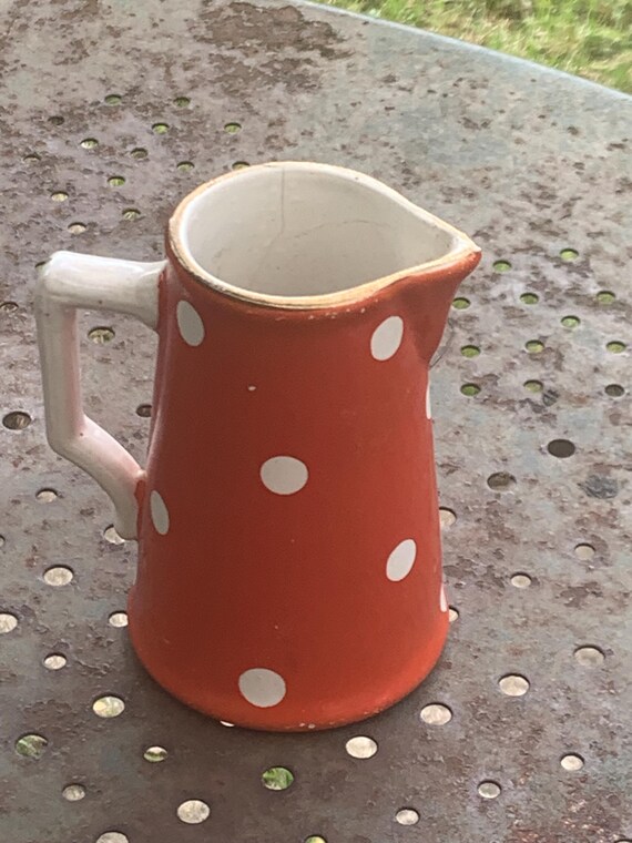 Milk jug, pitcher with white polka dots on orange earthenware, Sarreguemines and Digoin, France, antique
