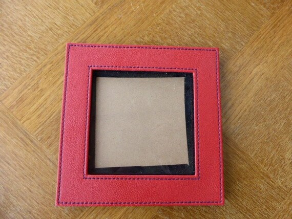 Square frame in red imitation leather back in black veins