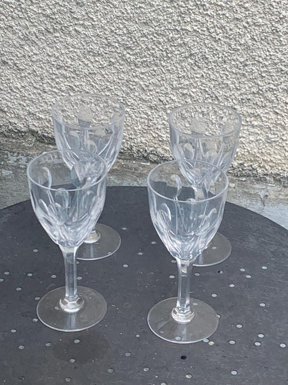 4 large antique-cut crystal wine glasses with beautiful designs