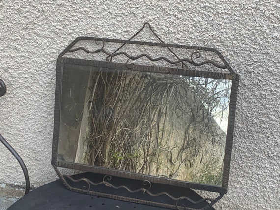 Art deco mirror in hammered metal and black wrought iron, rectangular shaped, trendy and antique
