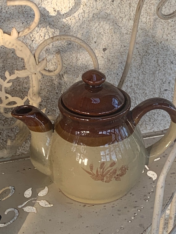 Glazed ceramic teapot, beige and brown, vintage floral pattern