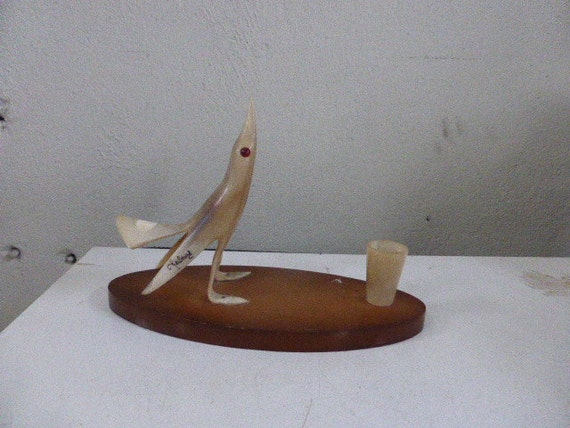 Horn bird on a wooden base pen holder, vintage 1960 pen holder; stamped "Cherbourg" holiday souvenir.
