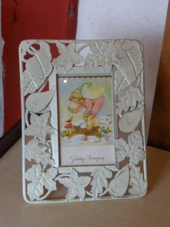 White foliage metal frame with an old art deco postcard, glass top