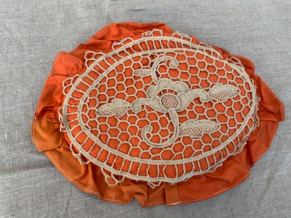 Orange cushion with old art deco openwork crochet embroidery