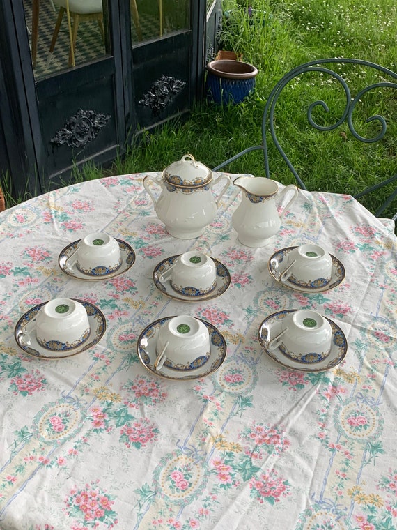 Art deco porcelain tea service, PP Limoges France stamp, white porcelain decorated with fruit baskets, composed of 14 pieces