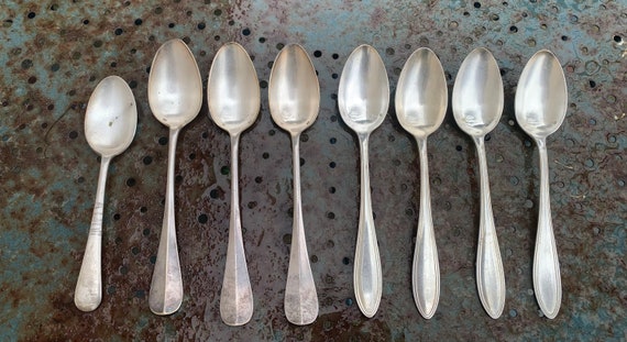 Lot of 8 mismatched soup spoons in silver metal, hallmarks, one monogrammed and one stamped Christofle and one E. Chartier, 1908