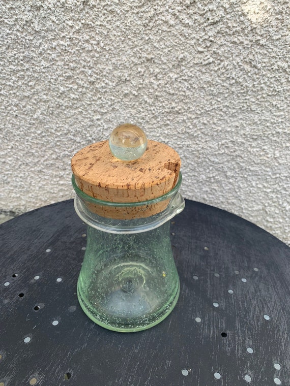 Jar for olives or gherkins in Biot bubbled glass, hand-blown, signed VERRERIE de BIOT, olive wood tongs and cork and glass stopper.