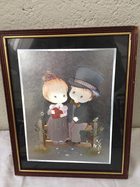 Hanging mirror frame, little girl and little boy in 1970s Sarah Kay vintage style costume,