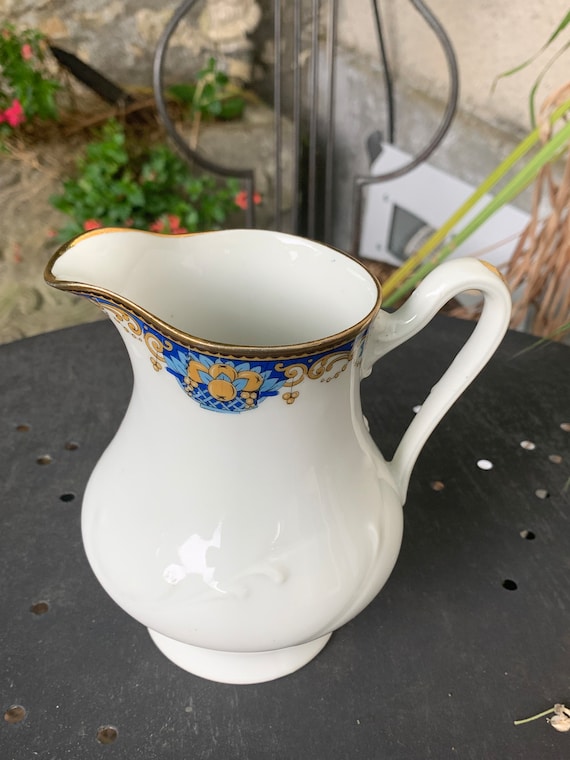 Sugar bowl and milk jug, PP stamp, Limoges, France, white porcelain with fruit basket decoration, Art Deco.