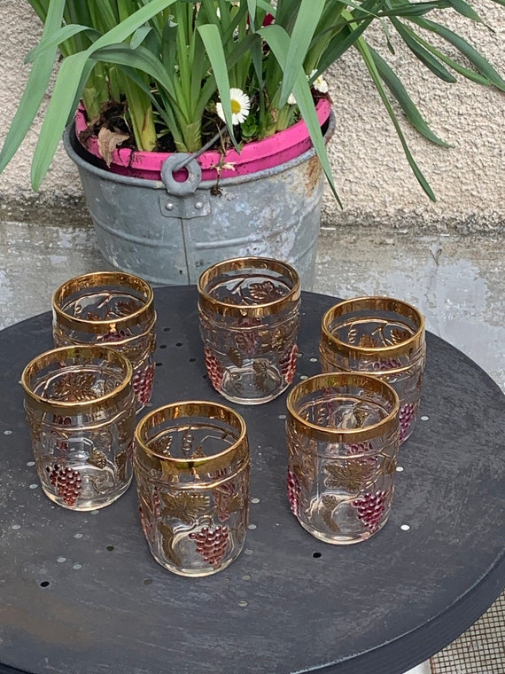 6 whiskey glasses with a pattern of bunches of grapes and vintage gold foliage