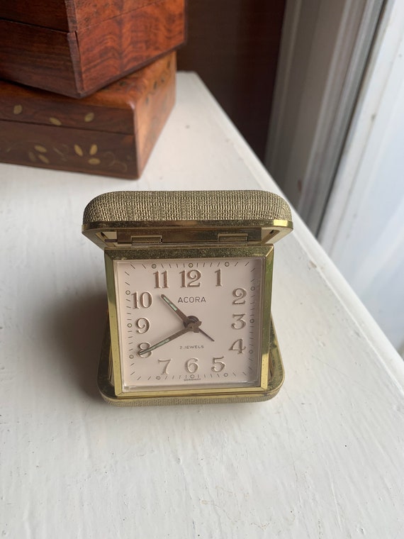 Small travel alarm clock, Acora, fluorescent hands, gilded figures