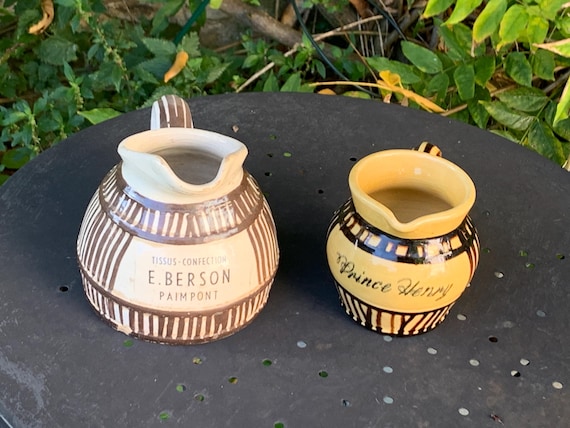Two old ceramic advertising pitchers. Prince Henry and number 2: fabrics made, E. Berson in Paimpont