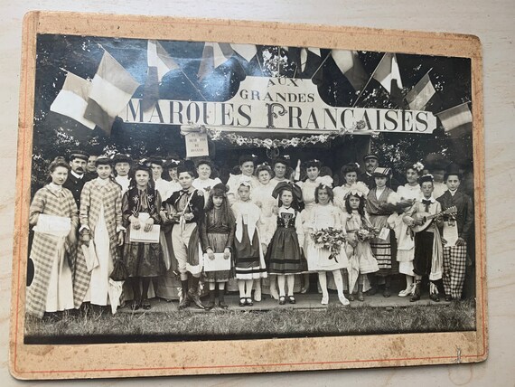 Photograph dated July 8, 1904, old, black and white, Aux Grandes Marques Francaises, the carnival of disguised children,