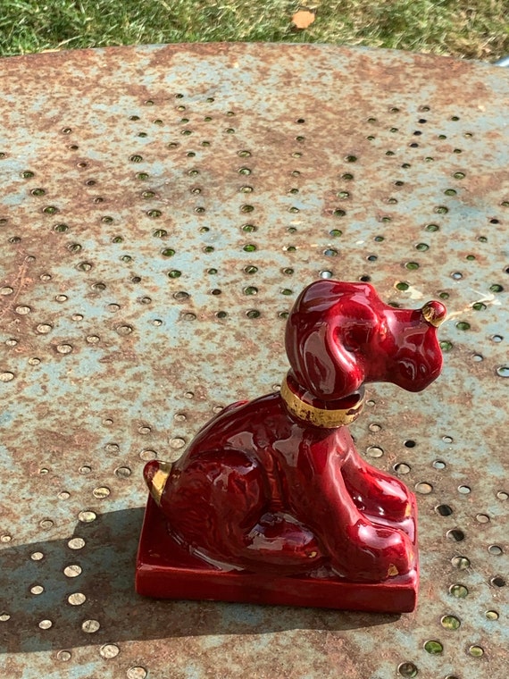 Dog sign CAB in vintage burgundy red enameled ceramic barbotine, art deco