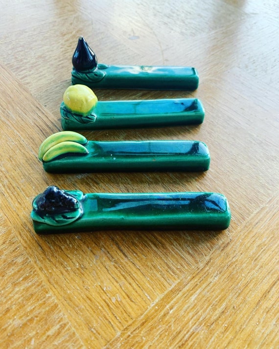 4 fruit and vegetable, barbotine knife holders in green enamelled ceramic, vintage