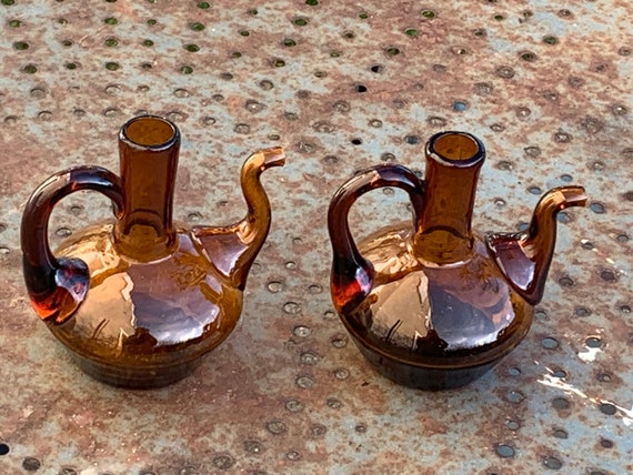 Two ocher, amber colored blown glass oil and vinegar bottles, vintage 1970