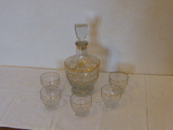 Decanter and 6 glasses transparent glass bottles and gold edging vintage 1950