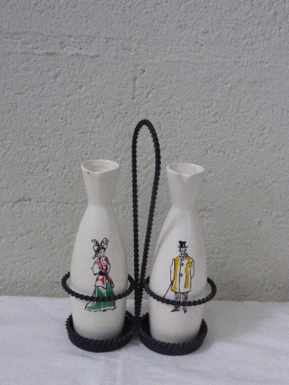 Servant oil and vinegar ceramic in a 1950 vintage wrought iron stand