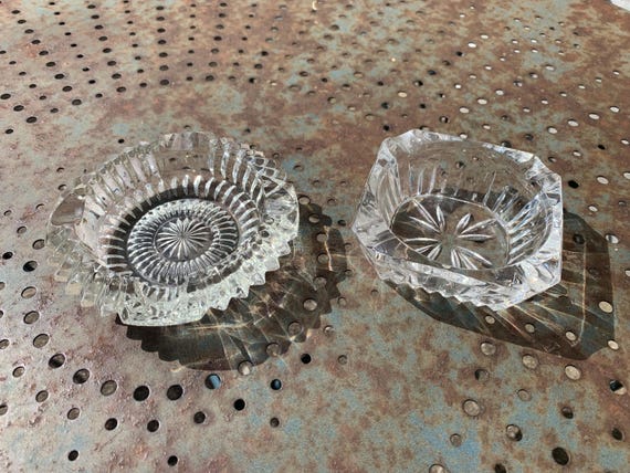Set of two elegant vintage glass and transparent crystal ashtrays