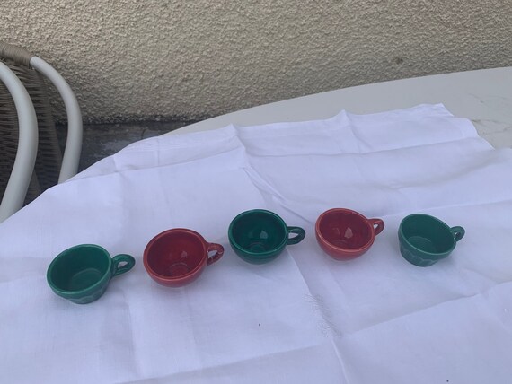 5 enamelled ceramic cups with liquor 3 green and 2 vintage red