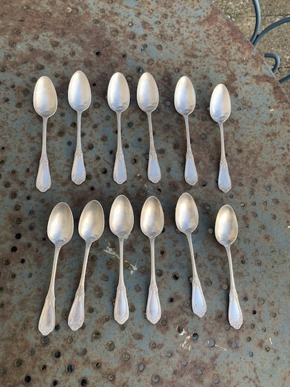 Set of 12 small spoons in silver metal, hallmark 18, goldsmith Apollo, in their original boxes, art nouveau pattern